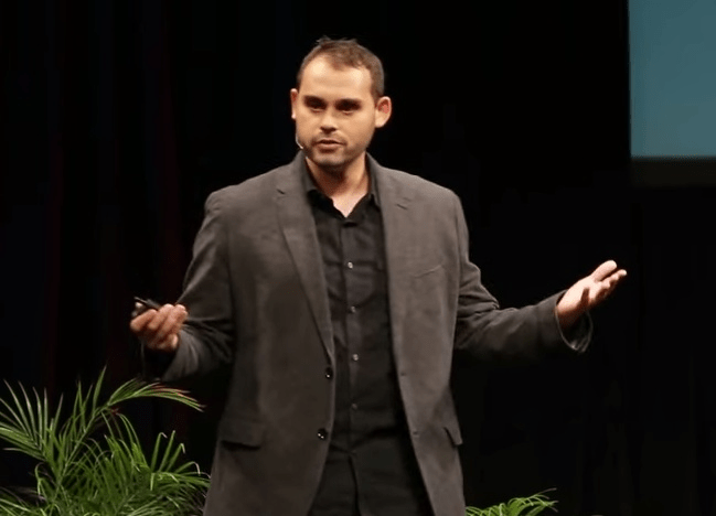 Paul Piff striking a very TED talk pose.