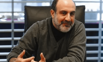 Taleb grinning smugly.